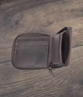 Handcrafted men’s oiled leather wallet with RFID protection, zip-around security, and smart organization. Durable, stylish, and built for adventure.
